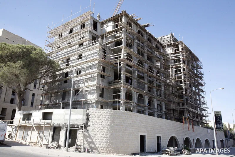 A part of work in Jewish settlement of Harmoun Hanatsave near the Arab neighbourhood of Ras al-Amud in Jerusalem on Oct. 30,2012. The Israeli occupation authority's approved to construct nearly 800 new settlement units i...