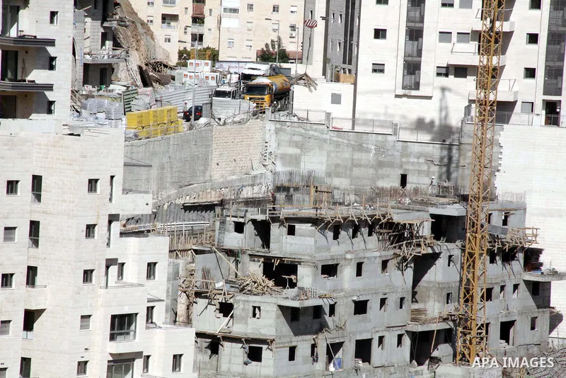 A part of work in Jewish settlement of Harmoun Hanatsave near the Arab neighbourhood of Ras al-Amud in Jerusalem on Oct. 30,2012. The Israeli occupation authority's approved to construct nearly 800 new settlement units i...