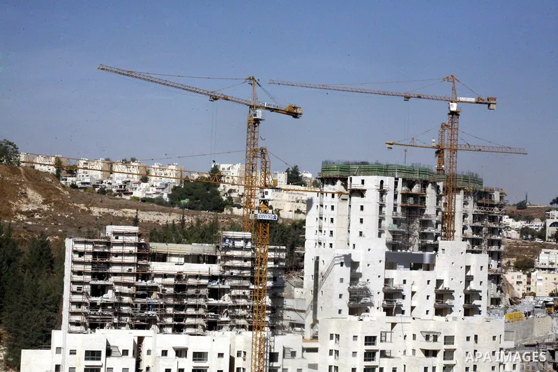 A part of work in Jewish settlement of Harmoun Hanatsave near the Arab neighbourhood of Ras al-Amud in Jerusalem on Oct. 30,2012. The Israeli occupation authority's approved to construct nearly 800 new settlement units i...