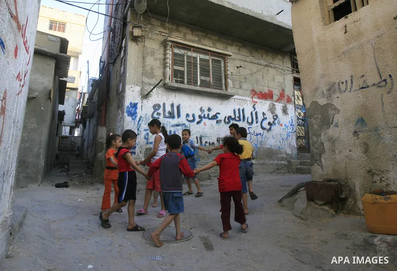 Palestinian children play in front of their houses, in Rafah refugee camp southern the Gaza strip, Oct. 30, 2012. In the aftermath of the Israeli military Operation Cast Lead in 2008/2009, Palestinian refugees in Gaza ca...