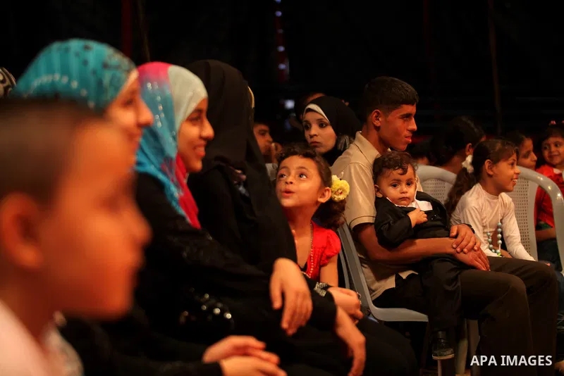 Palestinians watch members of the Egyptian National Circus as they practice in Gaza City on Oct. 30, 2012. The circus came to Gaza on Friday, accompanied by blaring music, juggling clowns and fire blowers but getting it...