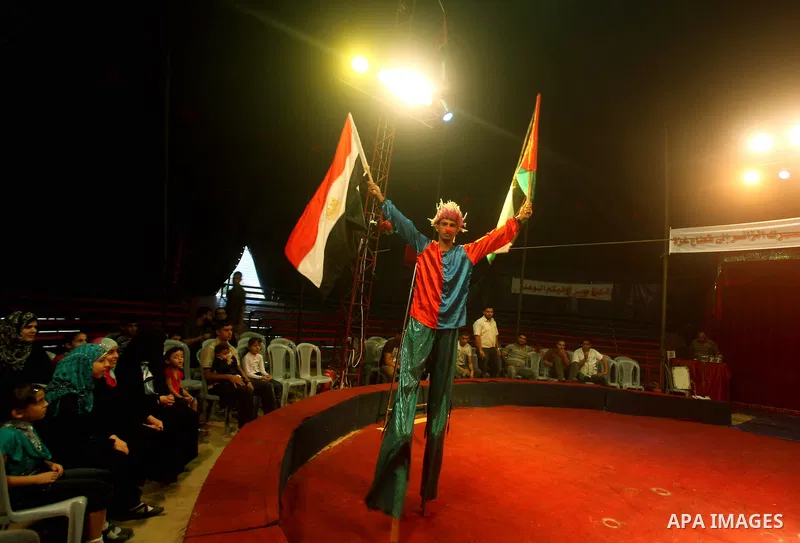 A member of the Egyptian National Circus practices in Gaza City on Oct. 30, 2012. The circus came to Gaza on Friday, accompanied by blaring music, juggling clowns and fire blowers but getting it there required its own hi...
