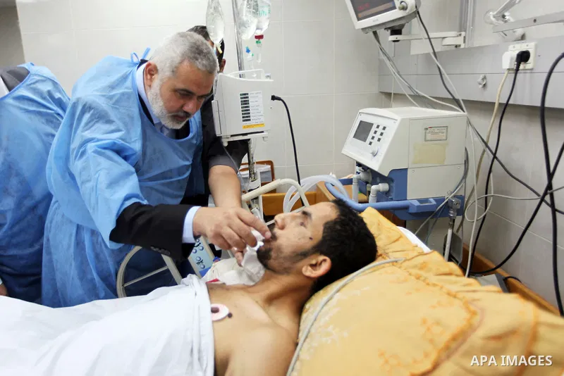 Palestinian Prime Minister in Gaza strip Ismail Haniyeh visits injured by Israeli airstrikes on Gaza strip at al-Shifa hospital in Gaza on Oct. 31, 2012. Israeli airstrikes killed many Palestinians and wounded others dur...