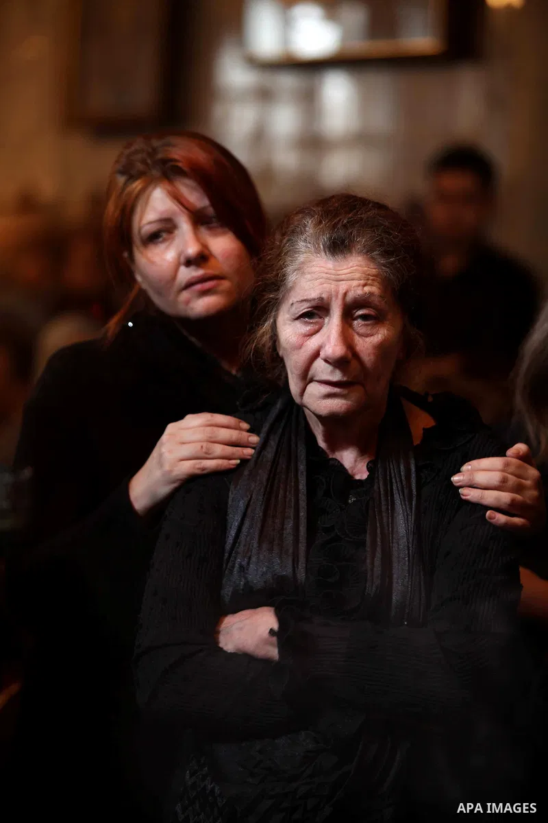 Palestinian relatives of Christian Hossam Al-Tawil mourn on his body during his funeral at the Church of Saint Porphyrius in Gaza city on Nov. 01, 2012. Al-Tawil passed away in Egypt after seeking medical treatment in th...