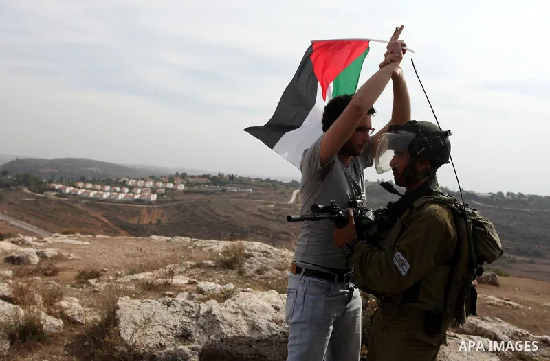 Palestinian man scuffle with Israeli soldiers during a protest against the expansion of the nearby Jewish settlement of Halamish, in the West Bank village of Nabi Saleh near Ramallah, Friday, Nov 2, 2012. Photo by Issam...