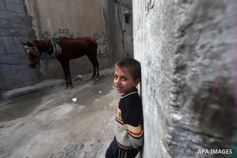 A Palestinian refugee boy stands outside his house in the Shati refugee camp in Gaza City on November 2, 2012. The turbulent political conditions that prevailed in Palestine after Balfour Declaration up to 1948, have sig...