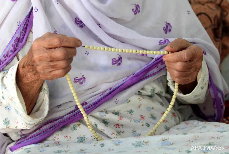 An elder Palestinian refugee woman sits next her house at the Shati Palestinian refugee camp in Gaza City on November 3, 2012. The issue of refugees is one of the thorniest elements of the Palestinian-Israeli conflict, w...