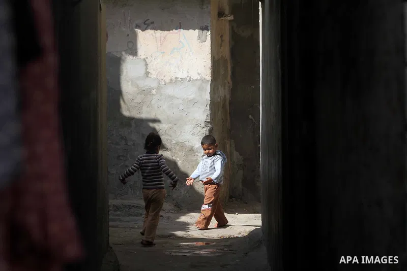 Palestinian children walk in an alley of the Shati Palestinian refugee camp in Gaza City on November 3, 2012. The issue of refugees is one of the thorniest elements of the Palestinian-Israeli conflict, with the Palestini...