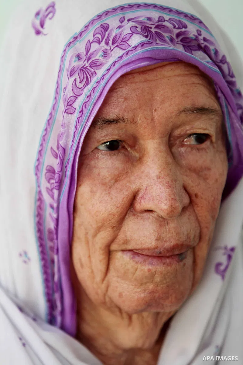 An elder Palestinian refugee woman sits next her house at the Shati Palestinian refugee camp in Gaza City on November 3, 2012. The issue of refugees is one of the thorniest elements of the Palestinian-Israeli conflict, w...