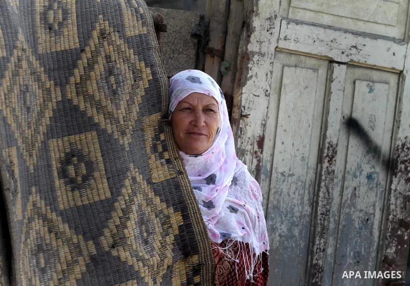 A Palestinian woman stands at the entrance to her house at the Shati Palestinian refugee camp in Gaza City on November 3, 2012. The issue of refugees is one of the thorniest elements of the Palestinian-Israeli conflict,...