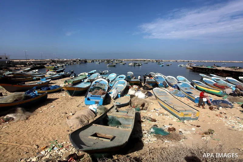 Palestinian fishermen enjoy their fishing time on the sea, during press conference about trial proceedings criminals Marmara massacre in Gaza port, on Nov. 04, 2012. Photo by Ashraf Amra