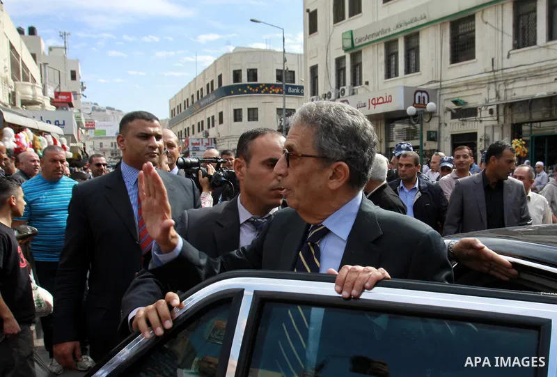 Egyptian politician and former Arab League secretary general, Amr Moussa walks around in the old town market in the west bank city of Nablus on November 4, 2012. Photo by Nedal Eshtayah