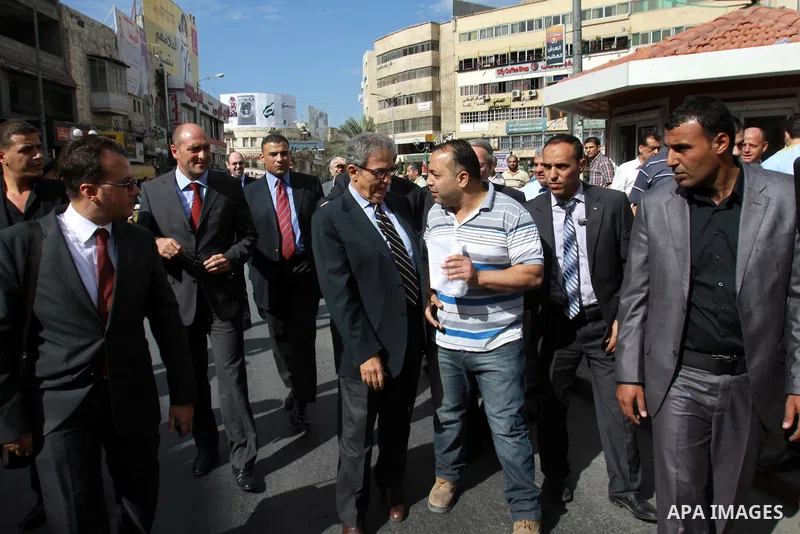 Egyptian politician and former Arab League secretary general, Amr Moussa walks around in the old town market in the west bank city of Nablus on November 4, 2012. Photo by Nedal Eshtayah