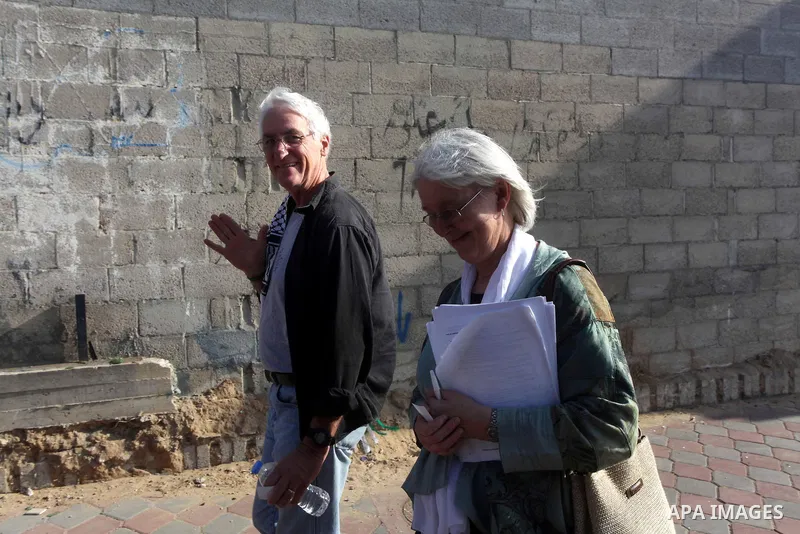 Cindy and Craig, the parents of Rachel Corrie, who was killed by an Israeli military bulldozer in 2003 walk in a street during a visit to Gaza strip in solidarity with Gazans and against Israel's blockade policy on 06 No...