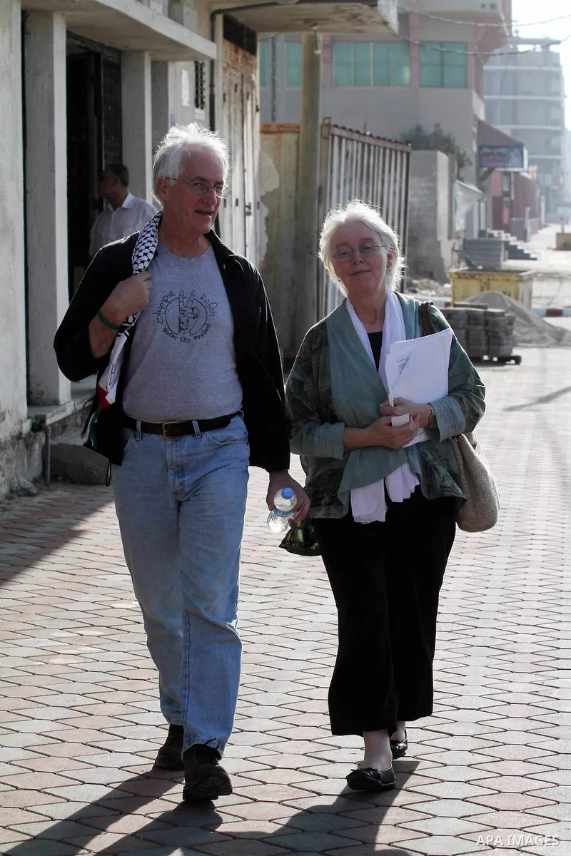 Cindy and Craig, the parents of Rachel Corrie, who was killed by an Israeli military bulldozer in 2003 walk in a street during a visit to Gaza strip in solidarity with Gazans and against Israel's blockade policy on 06 No...