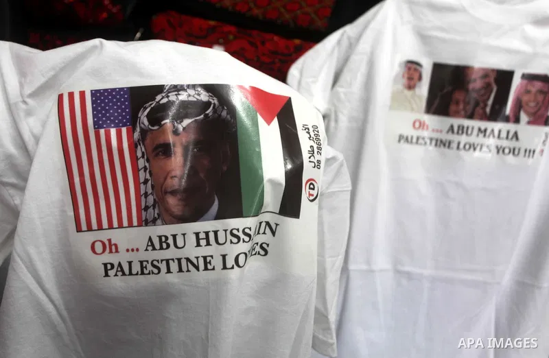 A Palestinian shop owner displays mugs for sale with portraits of leaders including US President Barack Obama, at a souvenir shop in Gaza City on Nov. 07, 2012. Democratic President Obama defeated Republican candidate Mi...
