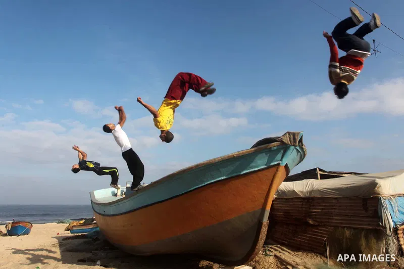 Palestinians youth practice his parkour skills, also known as free running, in the town of Khan Younis, in the southern Gaza Strip, on November 8, 2012. Some youths, aged between 12 and 23 years old, in Gaza are pracitis...