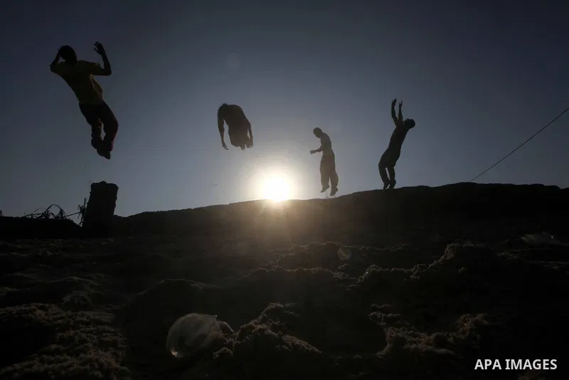 Palestinians youth practice his parkour skills, also known as free running, in the town of Khan Younis, in the southern Gaza Strip, on November 8, 2012. Some youths, aged between 12 and 23 years old, in Gaza are pracitis...