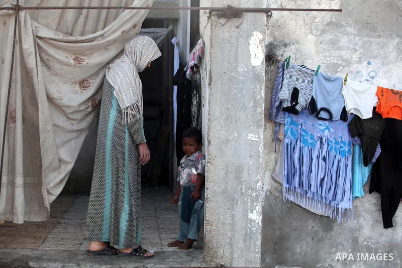 A Palestinian poor family live at the Shati Palestinian refugee camp in Gaza City on November 8, 2012. Photo by Majdi Fathi