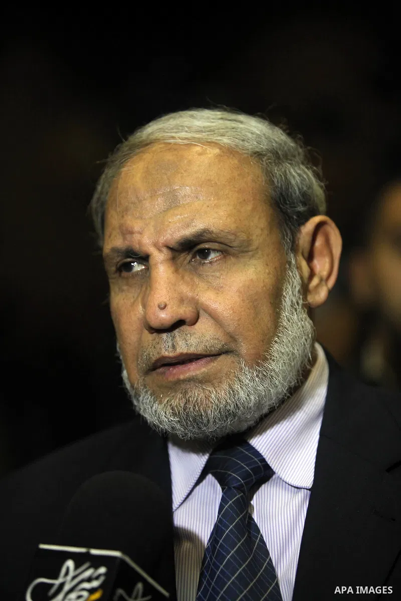Hamas leader, Mahmoud Al-Zahar speaks to media during the ceremony of the first show of the Palestinian-Egyptian Film "Lover of Rifle" in Gaza on November 8, 2012. Lover of Rifle is the first joint movie between Palestin...
