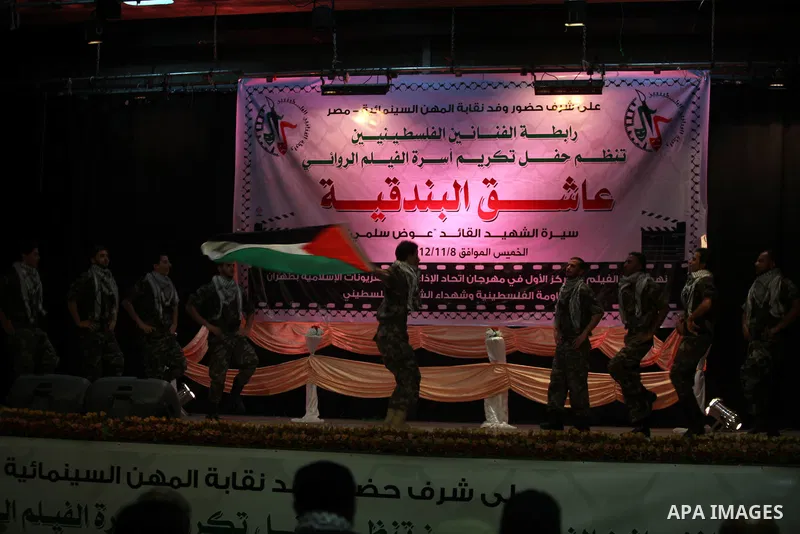 Palestinians perform dance during the ceremony of the first show of the Palestinian-Egyptian Film "Lover of Rifle" in Gaza on November 8, 2012. Lover of Rifle is the first joint movie between Palestinian and Egyptian art...