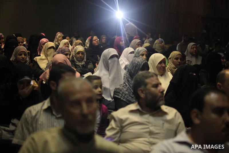 Palestinians attend the ceremony of the first show of the Palestinian-Egyptian Film "Lover of Rifle" in Gaza on November 8, 2012. Lover of Rifle is the first joint movie between Palestinian and Egyptian artists talks abo...