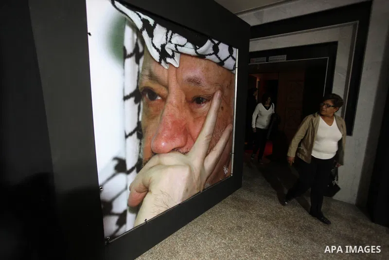 Palestinians gather to light candles at the mausoleum of their late leader Yasser Arafat in the West Bank city of Ramallah, on November 10, 2012, ahead of a ceremony marking the eighth anniversary of this death. The Pale...