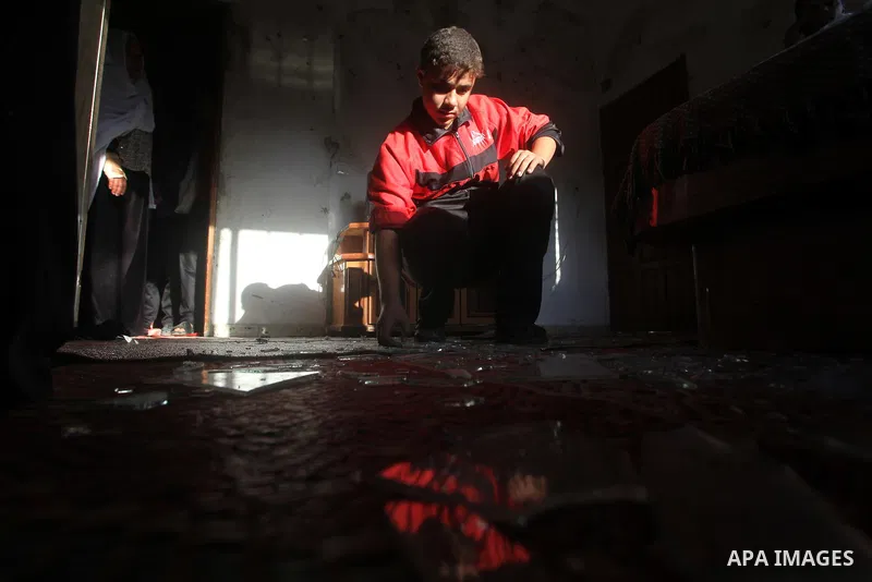 Palestinians inspect damage in their house damaged in an Israeli air strike in Gaza City November 11, 2012. An Israeli air strike killed a Palestinian militant in the Hamas-governed Gaza Strip on Sunday as a surge in cro...