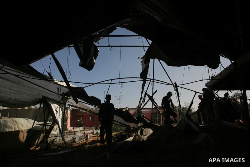 Palestinians inspect the damage to their home following an Israeli military air strike in Rafah town in the southern Gaza Strip, on November 11, 2012. The flare-up which began November 10, was one of the most serious sin...