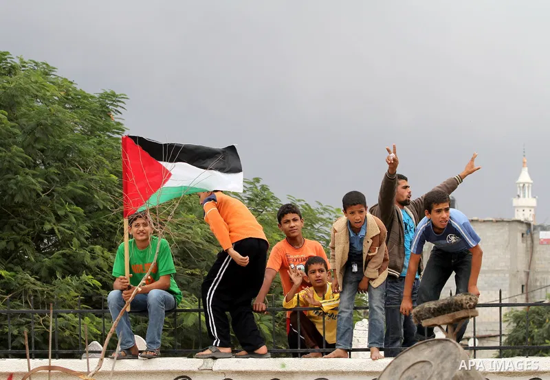 Palestinian relatives of killed civilian Ahmad Dardasawy, 18, mourn during his funeral in Gaza City on November 11, 2012, after he was killed the day before in Israeli shelling as clashes erupted along the Israeli-Gaza S...