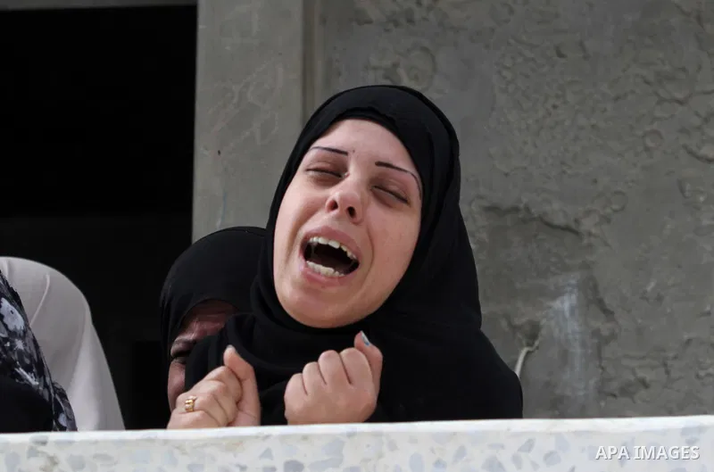 The sister of killed Palestinian Ahmad Dardasawy, 18, grieves at her home during his funeral in Gaza City on November 11, 2012 , the day after he was killed in Israeli shelling as clashes erupted along the Isreali-Gaza S...