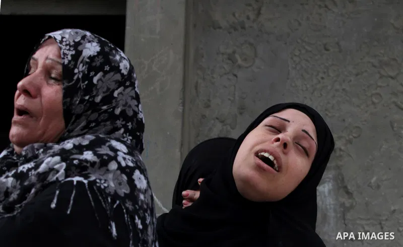 The sister of killed Palestinian Ahmad Dardasawy, 18, grieves at her home during his funeral in Gaza City on November 11, 2012 , the day after he was killed in Israeli shelling as clashes erupted along the Isreali-Gaza S...