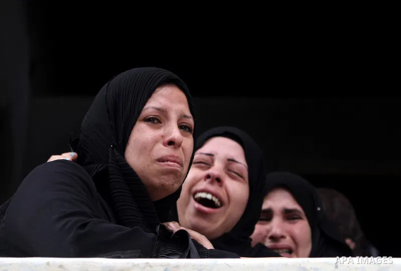 Palestinian relatives of killed civilian Ahmad Dardasawy, 18, mourn during his funeral in Gaza City on November 11, 2012, after he was killed the day before in Israeli shelling as clashes erupted along the Israeli-Gaza S...