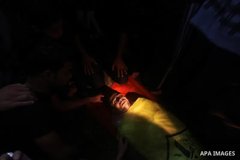 Mourners carry the body of Palestinian Matar Abu Ata, 20, killed in a recent Israeli strike, during his funeral in Gaza City, Sunday, Nov. 11, 2012. While cross-border fighting is a common occurrence, hostilities spirale...