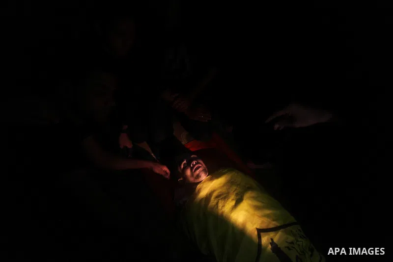 Mourners carry the body of Palestinian Matar Abu Ata, 20, killed in a recent Israeli strike, during his funeral in Gaza City, Sunday, Nov. 11, 2012. While cross-border fighting is a common occurrence, hostilities spirale...