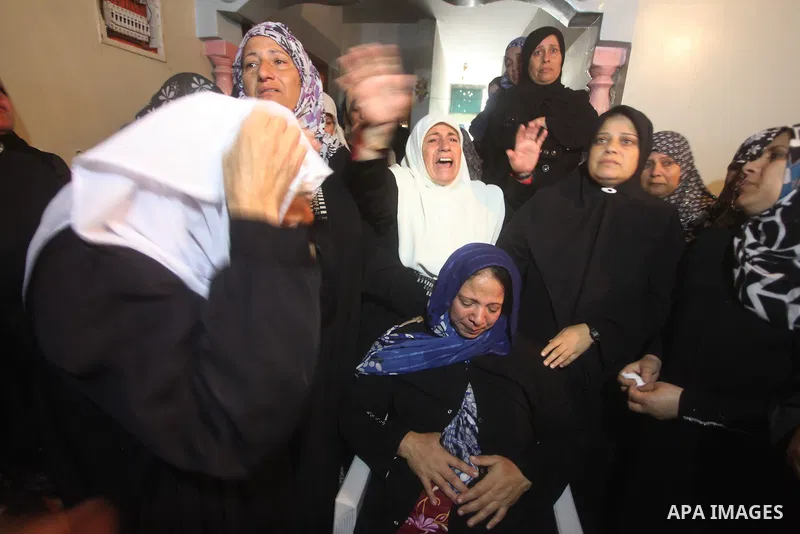 Palestinian women grieve during the funeral of Matar Abu Ata, 20, killed in an Israeli airstrike overnight, in Gaza City, Sunday, Nov. 11, 2012. While cross-border fighting is a common occurrence, hostilities spiraled sh...