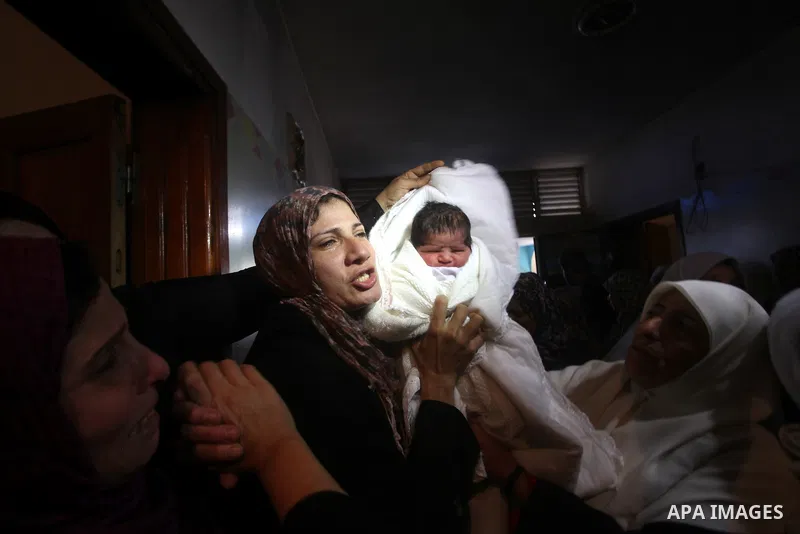 Palestinian women grieve during the funeral of Matar Abu Ata, 20, killed in an Israeli airstrike overnight, in Gaza City, Sunday, Nov. 11, 2012. While cross-border fighting is a common occurrence, hostilities spiraled sh...