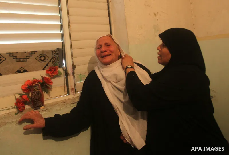 Palestinian women grieve during the funeral of Matar Abu Ata, 20, killed in an Israeli airstrike overnight, in Gaza City, Sunday, Nov. 11, 2012. While cross-border fighting is a common occurrence, hostilities spiraled sh...