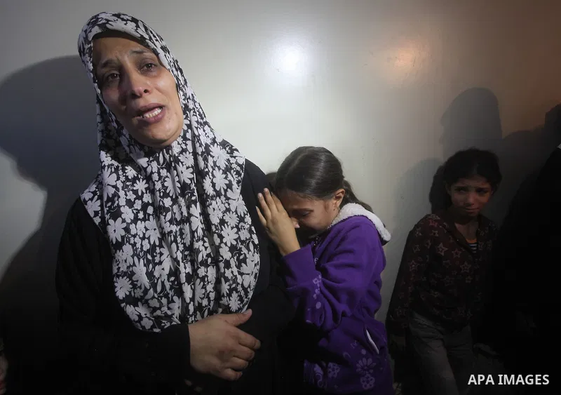 Palestinian women grieve during the funeral of Matar Abu Ata, 20, killed in an Israeli airstrike overnight, in Gaza City, Sunday, Nov. 11, 2012. While cross-border fighting is a common occurrence, hostilities spiraled sh...