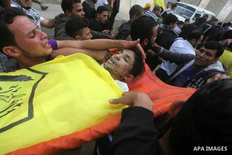 Mourners carry the body of Palestinian Matar Abu Ata, 20, killed in a recent Israeli strike, during his funeral in Gaza City, Sunday, Nov. 11, 2012. While cross-border fighting is a common occurrence, hostilities spirale...