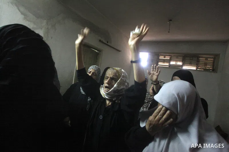 Palestinian women grieve during the funeral of Matar Abu Ata, 20, killed in an Israeli airstrike overnight, in Gaza City, Sunday, Nov. 11, 2012. While cross-border fighting is a common occurrence, hostilities spiraled sh...