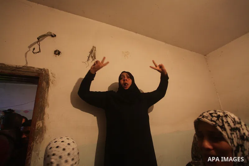 Palestinian women grieve during the funeral of Matar Abu Ata, 20, killed in an Israeli airstrike overnight, in Gaza City, Sunday, Nov. 11, 2012. While cross-border fighting is a common occurrence, hostilities spiraled sh...