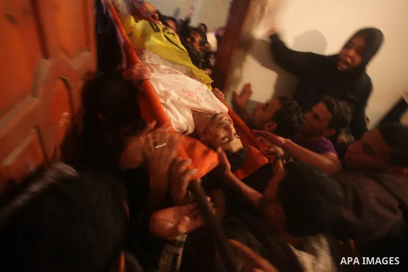 Mourners carry the body of Palestinian Matar Abu Ata, 20, killed in a recent Israeli strike, during his funeral in Gaza City, Sunday, Nov. 11, 2012. While cross-border fighting is a common occurrence, hostilities spirale...