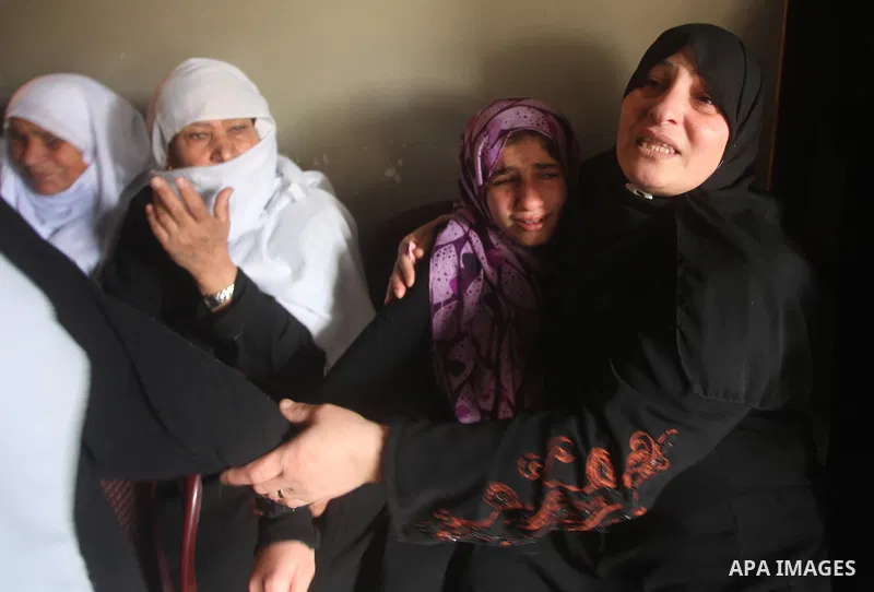Palestinian women grieve during the funeral of Matar Abu Ata, 20, killed in an Israeli airstrike overnight, in Gaza City, Sunday, Nov. 11, 2012. While cross-border fighting is a common occurrence, hostilities spiraled sh...