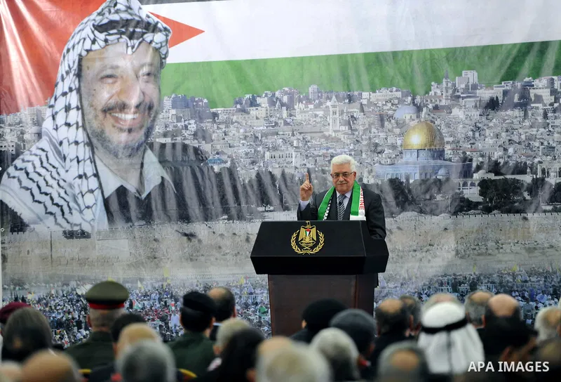 Palestinian President Mahmud Abbas delivers a speech to mark the eighth anniversary of the death of the late leader Yasser Arafat, in the West Bank city of Ramallah on November 11, 2012. Palestinians are coordinating wit...