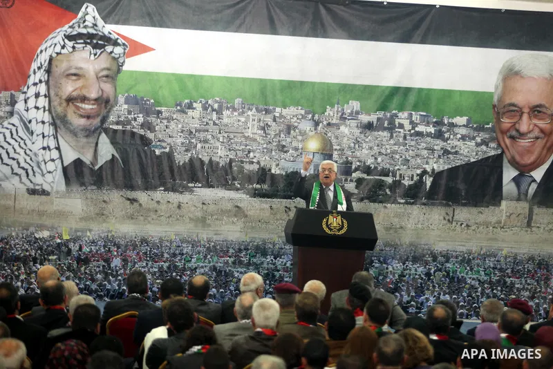Palestinian President Mahmud Abbas delivers a speech to mark the eighth anniversary of the death of the late leader Yasser Arafat, in the West Bank city of Ramallah on November 11, 2012. Palestinians are coordinating wit...