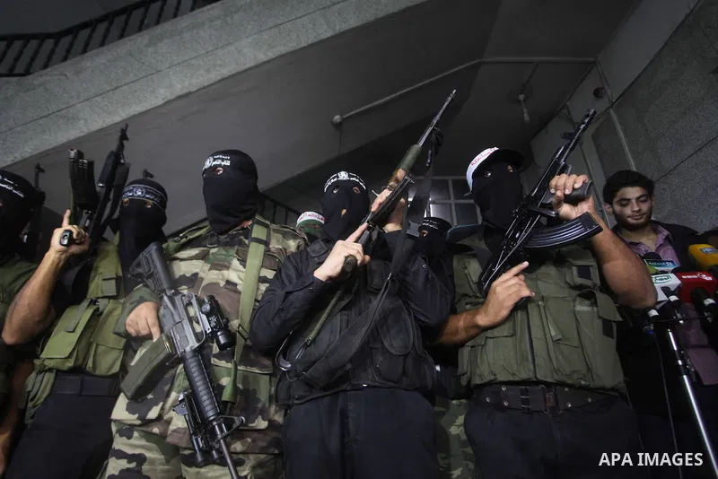 Palestinian masked gunmen, belonging to the Popular Resistance Committees (PRC), attend a press conference in Gaza City on November 11, 2012. The outbreak of violence was one of the most serious since Israel's devastatin...