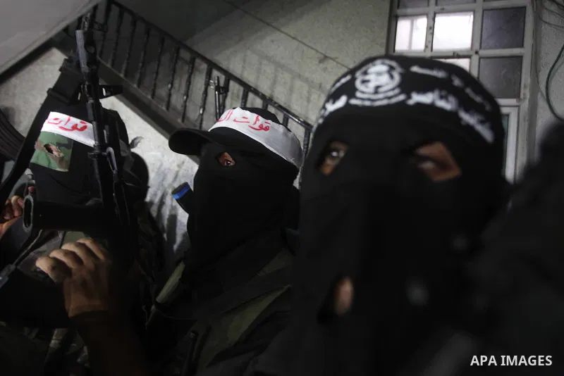 Palestinian masked gunmen, belonging to the Popular Resistance Committees (PRC), attend a press conference in Gaza City on November 11, 2012. The outbreak of violence was one of the most serious since Israel's devastatin...