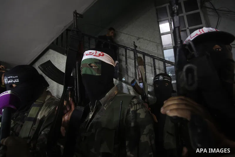 Palestinian masked gunmen, belonging to the Popular Resistance Committees (PRC), attend a press conference in Gaza City on November 11, 2012. The outbreak of violence was one of the most serious since Israel's devastatin...