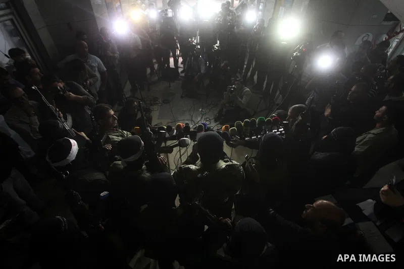 Palestinian masked gunmen, belonging to the Popular Resistance Committees (PRC), attend a press conference in Gaza City on November 11, 2012. The outbreak of violence was one of the most serious since Israel's devastatin...